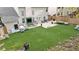 Large backyard with artificial turf and lots of patio furniture at 2798 Glenlocke Nw Cir, Atlanta, GA 30318