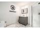 Unique bathroom boasting a shower, vanity with stone counter, and decor with cannabis accents at 2798 Glenlocke Nw Cir, Atlanta, GA 30318