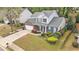 Beautifully landscaped two-story home with brick accents, an attached garage, and a cozy front porch at 2798 Glenlocke Nw Cir, Atlanta, GA 30318
