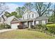 Charming two-story home with a well-manicured lawn and lovely landscaping at 2798 Glenlocke Nw Cir, Atlanta, GA 30318