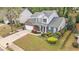 Beautifully landscaped two-story home with brick accents, an attached garage, and a cozy front porch at 2798 Glenlocke Nw Cir, Atlanta, GA 30318