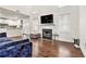 Spacious living room with hardwood floors, fireplace, and open access to the modern kitchen at 2798 Glenlocke Nw Cir, Atlanta, GA 30318