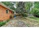 Charming backyard patio with stone pathway, beautiful landscaping, and mature trees at 3081 Anthony Dr, Decatur, GA 30033