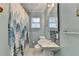 A bathroom with a decorative shower curtain, vanity, and modern fixtures at 3081 Anthony Dr, Decatur, GA 30033