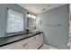 Stylish bathroom featuring a modern vanity with sleek countertops and a window with lots of natural light at 3081 Anthony Dr, Decatur, GA 30033