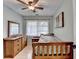 Bright bedroom featuring warm wood furniture and natural light from the window at 3081 Anthony Dr, Decatur, GA 30033
