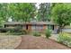 Charming single-story home with brick accents, lovely front yard, and inviting light blue front door at 3081 Anthony Dr, Decatur, GA 30033