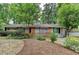 Charming single-story home with brick accents, lovely front yard, and inviting light blue front door at 3081 Anthony Dr, Decatur, GA 30033