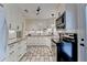 Well-lit kitchen with white cabinets, granite countertops, stainless steel appliances, and tile backsplash at 3081 Anthony Dr, Decatur, GA 30033