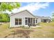 The backyard features a patio and well-maintained lawn and landscaping at 463 Marston Pass, Acworth, GA 30102