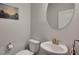 Modern powder room featuring sleek fixtures and a unique oval mirror at 463 Marston Pass, Acworth, GA 30102