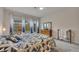 Serene bedroom featuring plush carpet, a comfortable bed, and bright windows that provide natural light at 463 Marston Pass, Acworth, GA 30102