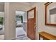 View of entryway featuring a wood bench and view of the home exterior through the open door at 463 Marston Pass, Acworth, GA 30102