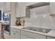 Modern kitchen with stainless steel appliances and sleek induction cooktop at 463 Marston Pass, Acworth, GA 30102