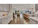 Spacious kitchen open to the living room with hardwood floors and a large island at 463 Marston Pass, Acworth, GA 30102
