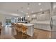 Bright kitchen with large island, pendant lights, and stainless steel appliances at 463 Marston Pass, Acworth, GA 30102