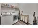 Laundry room with front load washer and dryer and wire storage at 463 Marston Pass, Acworth, GA 30102