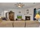 Comfortable living room with a fireplace, plush seating, and a ceiling fan, offering a cozy atmosphere at 463 Marston Pass, Acworth, GA 30102
