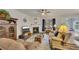 Inviting living room features a fireplace, plush seating, and seamless flow into other living spaces at 463 Marston Pass, Acworth, GA 30102