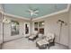 Covered screened porch with ceiling fan, patio furniture, and outdoor decor at 463 Marston Pass, Acworth, GA 30102