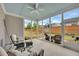 Screened-in porch featuring comfortable seating and views of the fenced backyard at 463 Marston Pass, Acworth, GA 30102