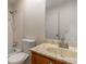 Well-lit bathroom features a vanity sink and toilet, complete with ample storage and mirror at 6900 Roswell Rd # F6, Atlanta, GA 30328
