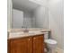 Well-appointed bathroom features a vanity sink and toilet, offering essential amenities in a compact space at 6900 Roswell Rd # F6, Atlanta, GA 30328