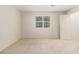 Serene bedroom with a window offering natural light, and soft carpeting for added comfort at 6900 Roswell Rd # F6, Atlanta, GA 30328