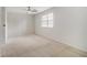 Comfortable bedroom with a ceiling fan and a bright window at 6900 Roswell Rd # F6, Atlanta, GA 30328