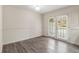 Bright and airy bedroom with hardwood floors and double doors at 6900 Roswell Rd # F6, Atlanta, GA 30328
