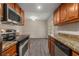 This kitchen boasts granite counters and stainless steel appliances with an adjacent dining area at 6900 Roswell Rd # F6, Atlanta, GA 30328