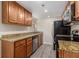 Modern kitchen featuring granite countertops, stainless appliances, and hardwood floors at 6900 Roswell Rd # F6, Atlanta, GA 30328
