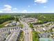 Aerial view of neighborhood highlighting its location near shopping centers, roads, and community amenities at 138 Fox Creek Dr, Woodstock, GA 30188