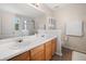 Bathroom featuring double sinks, a large mirror, and a separate shower at 138 Fox Creek Dr, Woodstock, GA 30188
