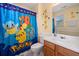 Fun bathroom with a Pokemon-themed shower curtain and colorful accents at 138 Fox Creek Dr, Woodstock, GA 30188