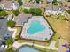 Aerial shot of the community pool with lounge chairs, tables, and manicured landscape, offering a relaxing environment at 138 Fox Creek Dr, Woodstock, GA 30188