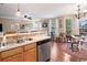 Kitchen with a stainless steel dishwasher and a breakfast bar that overlooks the adjacent living room and dining area at 138 Fox Creek Dr, Woodstock, GA 30188