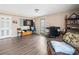 Living room with a work area, wood floors, and an exterior door at 138 Fox Creek Dr, Woodstock, GA 30188