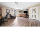 Inviting living room featuring wood floors, natural light and comfortable seating at 138 Fox Creek Dr, Woodstock, GA 30188