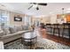 Spacious living room with hardwood floors flowing into the dining area and kitchen at 138 Fox Creek Dr, Woodstock, GA 30188
