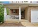 Inviting front porch with white columns and railing, offering a cozy outdoor seating area at 138 Fox Creek Dr, Woodstock, GA 30188
