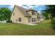 Backyard featuring a spacious yard, patio, and large windows offering beautiful outdoor views at 481 Jefferson Chase Se Cir, Atlanta, GA 30354
