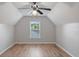 Bright bedroom featuring hardwood floors, a ceiling fan, and a large window for lots of natural light at 481 Jefferson Chase Se Cir, Atlanta, GA 30354