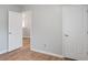 Neutral bedroom with hardwood floors and paneled doors providing an uncluttered simple space at 481 Jefferson Chase Se Cir, Atlanta, GA 30354
