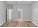 This bedroom features hard wood floors, recessed ceiling, and access to the walk-in closet at 481 Jefferson Chase Se Cir, Atlanta, GA 30354