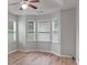 This is a bright bedroom with a ceiling fan and a large window overlooking the yard at 481 Jefferson Chase Se Cir, Atlanta, GA 30354