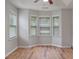 This bright bedroom features a ceiling fan, recessed ceiling and a large bay window overlooking the yard at 481 Jefferson Chase Se Cir, Atlanta, GA 30354