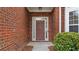 Close-up view of brick entryway, featuring a sidelight door at 481 Jefferson Chase Se Cir, Atlanta, GA 30354