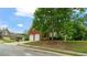 Charming home featuring a brick facade, well-manicured lawn and mature trees at 481 Jefferson Chase Se Cir, Atlanta, GA 30354