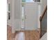 Inviting front door with sidelights and wood-look flooring in the foyer at 481 Jefferson Chase Se Cir, Atlanta, GA 30354